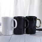 Wholesale high quality embossed shape golden handle black coffee mug ceramic mug