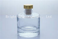 round glass perfume bottle with wooden lid