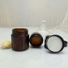 Face cream amber glass jar with black plastic cap