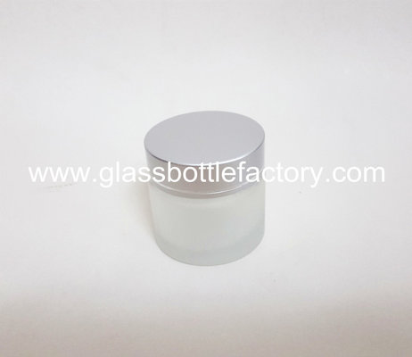 China 60g Cylinder Frost Glass Cosmetic Jar With Silver Lid supplier