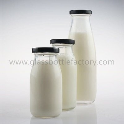 China 200ml,250ml,500ml Clear Glass Milk Bottles With Caps supplier