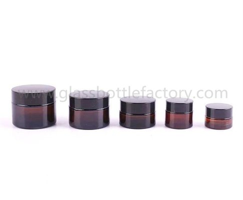 China 5g,10g,15g,20g,30g,50g,100g Amber Round Glass Cosmetic Jars With Lids supplier