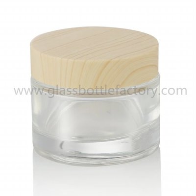 China 50g Round Glass Cosmetic Jar With Wood Lid supplier