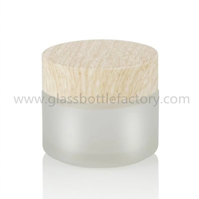 China 100g Clear,Frost Glass Cosmetic Jars With Wood Lids supplier