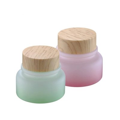 China 50g Green and Pink Glass Cosmetic Jars With Wood Lids supplier