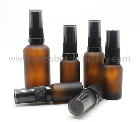 China 5ml-100ml Amber Frost Essential Oil Glass Bottles with New Black Plastic Pumps supplier