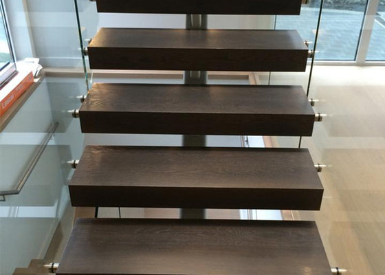 black solid wooden tread staircase with tempered clear glass railing