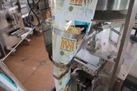 Automatic sachet popcorn/nuts/chips packing machine with cup volumetric filler